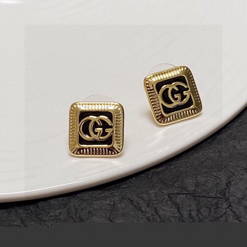 G*u*i earrings